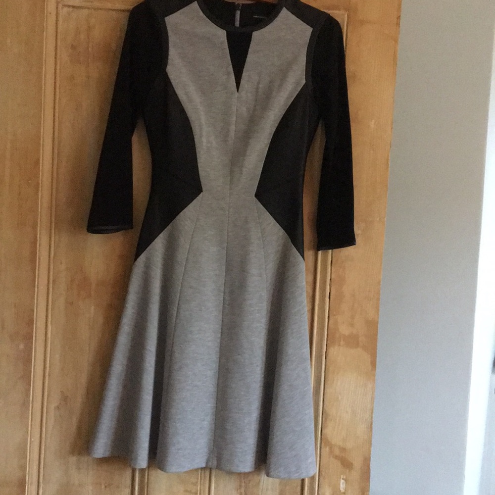 Fully lined , well tailored mid length dress.